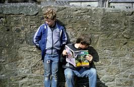 Warren Masters and Luke Rake at Gidleigh youth hostel, with Gidleigh church behind