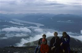 Daniel Coles, Damian Cannon, Damian Williams and Ian Malem with Corpach in the distance