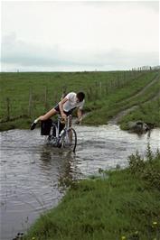 Michael Hall has problems negotiating the flood on Mastiles Lane