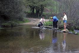 David Cutts rides through the ford at North Bovey with Paul H-W looking on