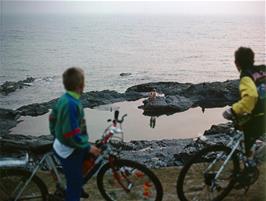 Philip Harler and David Waldron watch from above while some of our members enjoy a swim in the natural rock pool near the hostel [New scan, July 2019]