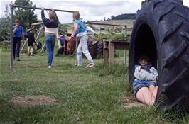 Neil Ault takes his turn in the tyre at Broadhempston play park [Remastered scan, July 2019]