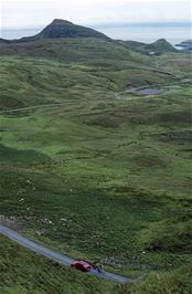 View to the cemetary car park and Dun Mor, from the Quiraing viewpoint on Skye [New photo, July 2019]