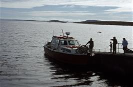 Mr McAskell, the ferryman, loading our bikes onto his ferry at Newtonferry, Isle of North Uist [New scan, July 2019]