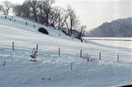 Returning to Crowcombe hostel we noticed these children enjoying the snow on May Hill, with Dunster Castle behind [New scan, June 2019]