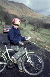 Joseph Bellows on the hostel driveway with his stamped YHA card on a fine sunny morning [Remsatered scan, June 2019]