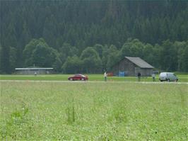 Audi TT racing on the Gstaad Airport runway on the approach to Saanen