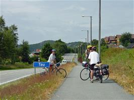 Tao being photographed and videoed by Michael in the village of Tau, 11.3 miles into the ride