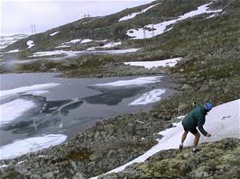 Tao attempts to skim stones on the semi-frozen lake just beyond Fagernut