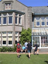 The group settles down for a group photo at the front of Salcombe Youth Hostel