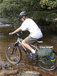 Gage Conway rides the West Dart River at Huccaby