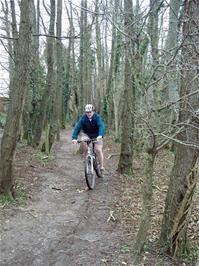 Gavin rides the path towards Brutus Bridge