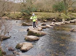 Peter Heathman carefully crosses the stepping stones at Dartmeet