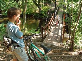 Dennis watches Josh trying out a footbridge off the Fisherman's Path