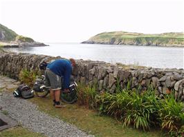 Gavin loads his bike outside Clear Island Youth Hostel