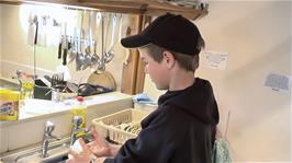 Josh, doing more than his fair share by washing the dishes after breakfast, something he said he would never be caught doing on camera