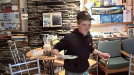 Josh going beyond the call of duty by kindly clearing the table after breakfast