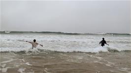 Such is their determination to enjoy a beach on this tour that both lads go in wearing their cycling gear