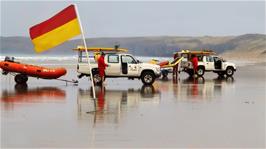 Lifeguards on duty on Perranporth Beach, moving with the tide