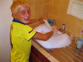 Glen does his washing up after breakfast