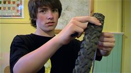 Matt starts to repair his puncture in Street Youth Hostel