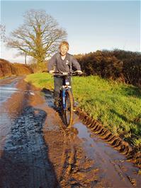 Alex demonstrating his love of muddy puddles near Staverton