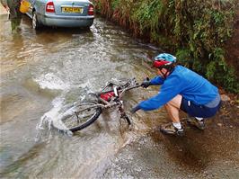 Tao follows the old man's lead and washes his bike