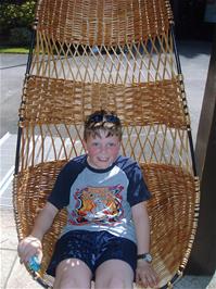 Ashley tries out the willow seat at the Wetlands centre
