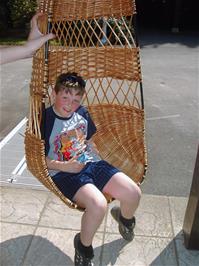 Ashley tries out the willow seat at the Wetlands centre