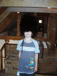Zac tries on the Bearskin at the Willows and Wetlands Centre, Meare Green