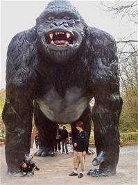 Ashley & Matt dwarfed by the gorilla at Wookey Hole