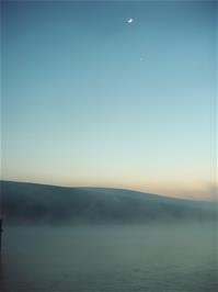 The moon watches the scene