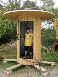 Sam demonstrates the mysterious solar-heated decontamination chamber