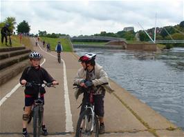 Ashley and Zac wait by the canal while youngsters from Millfield School begin to ride in our direction