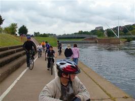 Ashley and Zac wait by the canal while youngsters from Millfield School begin to ride in our direction