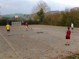The boys play "rugby" with a local youngster in Broadhempston Play Park - new photo for 2025