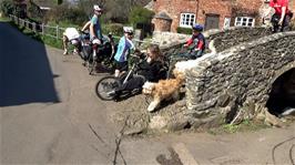 A very unusual recumbent tricycle with Rann trailer crosses the bridge at Allerford