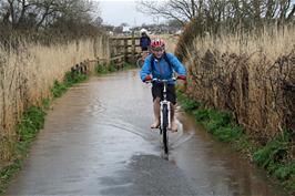 Barefoot George emerges from the flood