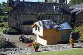 A rather expensive wooden "caravan" on display at The Cider Press Centre, Dartington