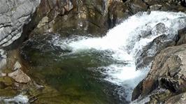 An inviting but icy natural jacuzzi on the approach to Turtagrø