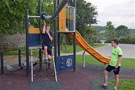 George rides the bar at Broadhempston play park