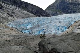 People waiting to climb the enormous glacier - and some actually climbing it