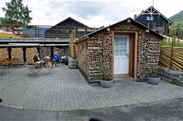 Firewood stacks in the Bakery courtyard, Lom.  A bestselling book in Norway describes how to chop and stack firewood and how to use it to construct buildings