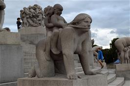 "Boy and girl riding on mother's back", 1916