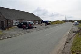 Unloading the bikes from the two cars at Flash village hall