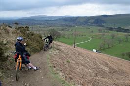 Dillan admires the fabulous views back to Castleton, from the path up Barker Bank to Hollins Cross