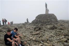 Waiting our turn to stand on the trig point on Ben Nevis Cairn