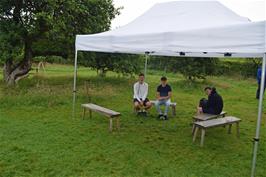 Taking shelter under the marquee at Hill Top