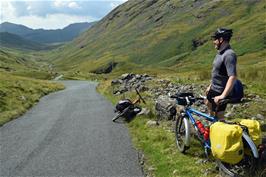 The descent to Wrynose Bottom, with Hardknott Pass rising up to the horizon