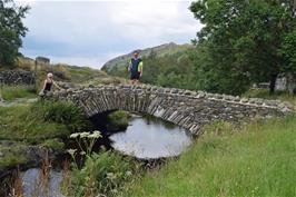 Tao on the stone footbridge at Watendlath